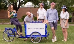 Royal Canadian Mead team surrounding their Marketing bike with bottled Royal Canadian Mead in Hamilton Ontario.